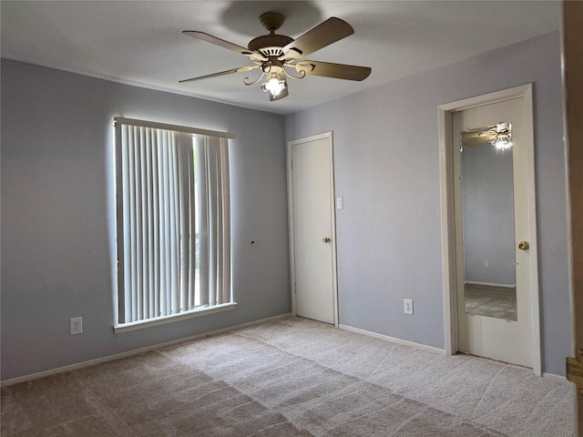 3300 Pebblebrook Dr Unit 106, Seabrook, TX 77586 - spare room featuring ceiling fan, carpet floors, and baseboards