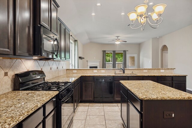 122 Jacobs Meadow Dr, Conroe, TX 77384 - kitchen with black appliances, a sink, decorative backsplash, a ceiling fan, and arched walkways