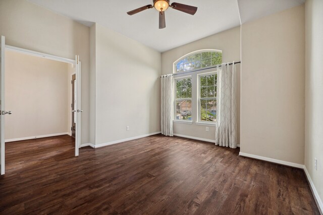 122 Jacobs Meadow Dr, Conroe, TX 77384 - spare room with a ceiling fan, wood finished floors, and baseboards