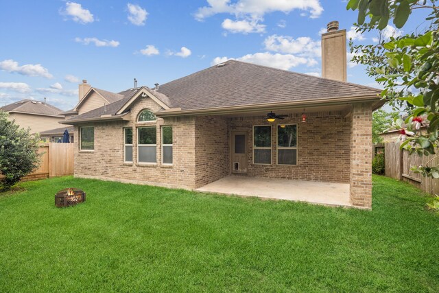 122 Jacobs Meadow Dr, Conroe, TX 77384 - back of house featuring a fire pit, brick siding, a ceiling fan, and a patio