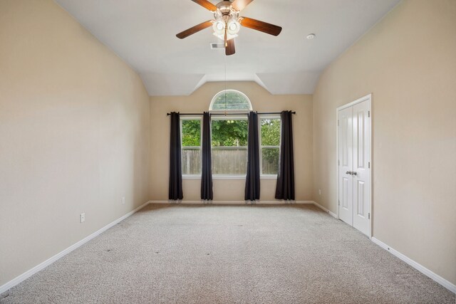122 Jacobs Meadow Dr, Conroe, TX 77384 - spare room with a ceiling fan, carpet flooring, baseboards, and lofted ceiling