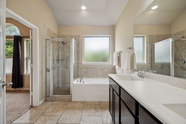 122 Jacobs Meadow Dr, Conroe, TX 77384 - bathroom with plenty of natural light, a bath, a stall shower, and lofted ceiling