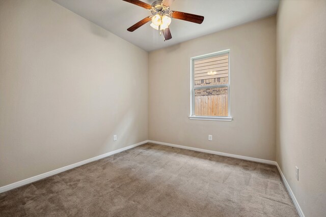 122 Jacobs Meadow Dr, Conroe, TX 77384 - empty room with carpet flooring, baseboards, and ceiling fan