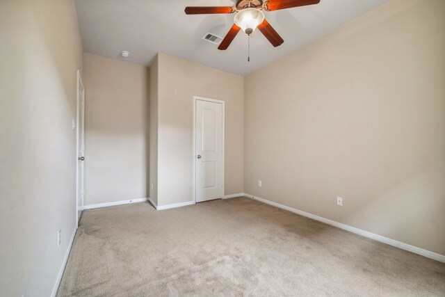 122 Jacobs Meadow Dr, Conroe, TX 77384 - unfurnished bedroom with light colored carpet, baseboards, and ceiling fan