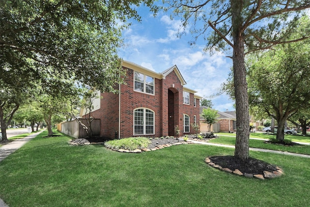 8742 Melting Shadows Ln, Houston, TX 77095 - view of front of property with brick siding and a front yard
