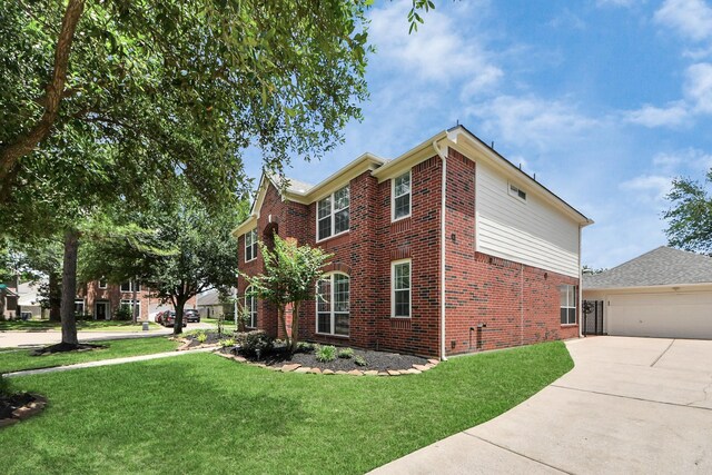 8742 Melting Shadows Ln, Houston, TX 77095 - view of front facade featuring brick siding, a front lawn, a garage, and driveway