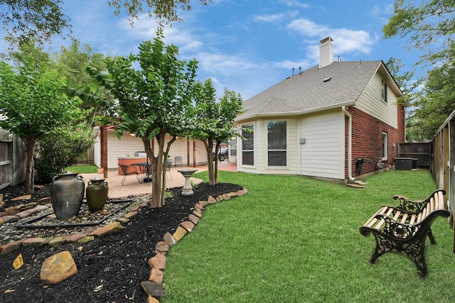 8742 Melting Shadows Ln, Houston, TX 77095 - rear view of house featuring cooling unit, brick siding, a patio, a chimney, and a shingled roof