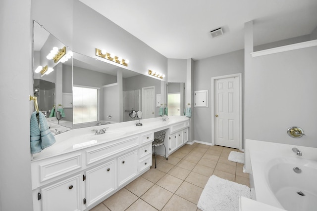 8742 Melting Shadows Ln, Houston, TX 77095 - bathroom featuring double vanity, a bath, and tile patterned floors