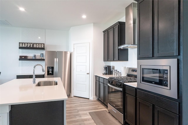12327 Brandenburg Gate Dr, Houston, TX 77047 - kitchen with stainless steel appliances, a sink, wall chimney exhaust hood, light countertops, and light wood-type flooring