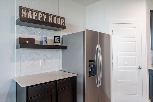 12327 Brandenburg Gate Dr, Houston, TX 77047 - kitchen with open shelves, tasteful backsplash, stainless steel refrigerator with ice dispenser, and light countertops