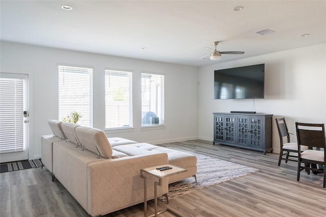 12327 Brandenburg Gate Dr, Houston, TX 77047 - living room featuring ceiling fan, wood finished floors, and baseboards