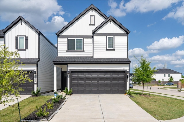 12327 Brandenburg Gate Dr, Houston, TX 77047 - view of front of home featuring board and batten siding, a garage, a shingled roof, and a front yard