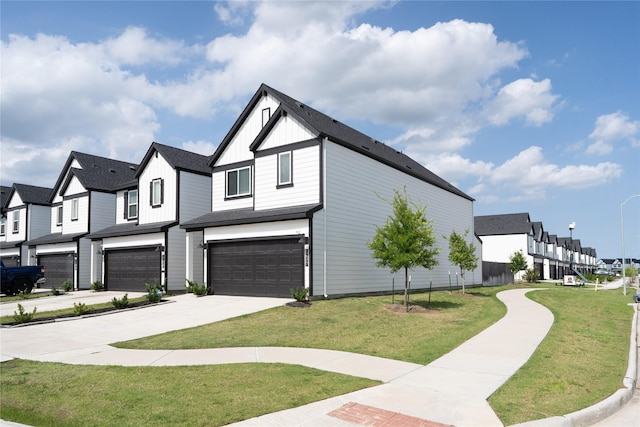 12327 Brandenburg Gate Dr, Houston, TX 77047 - view of side of home featuring an attached garage, board and batten siding, a residential view, driveway, and a yard
