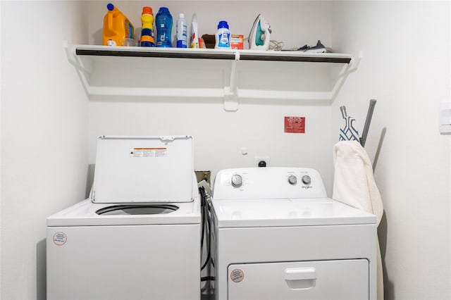 12327 Brandenburg Gate Dr, Houston, TX 77047 - laundry room with washer and clothes dryer