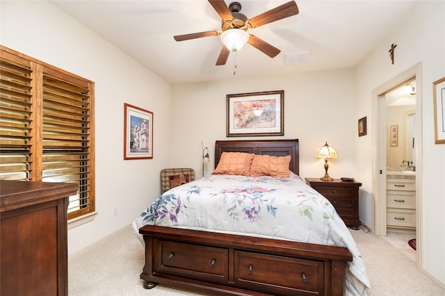 16119 Villa Fontana Way, Houston, TX 77068 - bedroom featuring light carpet, a ceiling fan, connected bathroom, and a sink