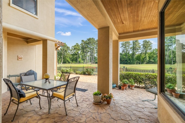 16119 Villa Fontana Way, Houston, TX 77068 - fenced backyard featuring a patio, view of scattered trees, and outdoor dining area