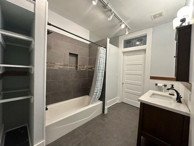 236 8th St, Somerville, TX 77879 - full bathroom with shower / tub combo with curtain, tile patterned floors, vanity, and rail lighting