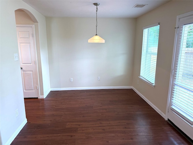 15415 Bammel Oaks Ct, Houston, TX 77014 - unfurnished room featuring dark wood-style flooring, arched walkways, and baseboards