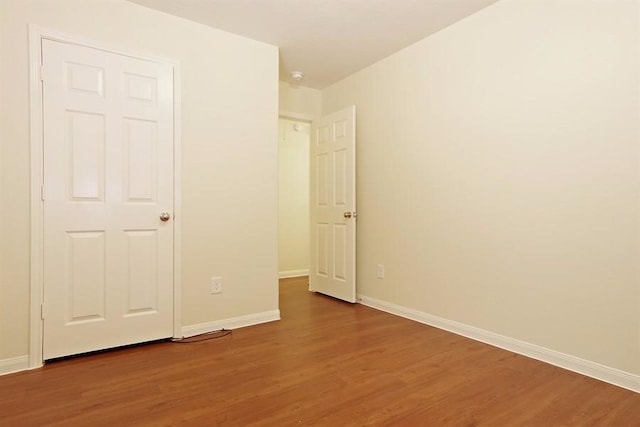 15415 Bammel Oaks Ct, Houston, TX 77014 - unfurnished bedroom with wood finished floors and baseboards