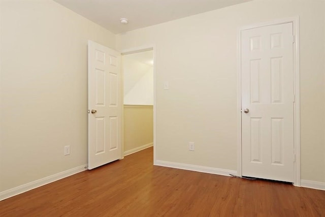 15415 Bammel Oaks Ct, Houston, TX 77014 - unfurnished bedroom with wood finished floors and baseboards