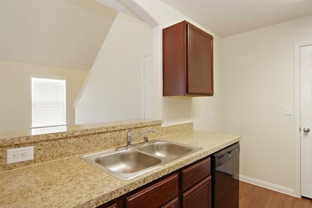 15415 Bammel Oaks Ct, Houston, TX 77014 - kitchen featuring dishwasher, a sink, light countertops, wood finished floors, and baseboards