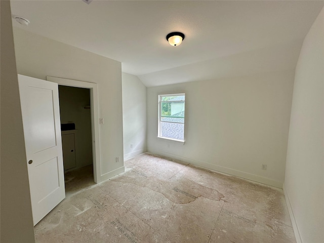 16522 Cub Creek Ct, Conroe, TX 77302 - unfurnished bedroom featuring vaulted ceiling and baseboards