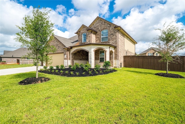 7314 Laguna Lake Dr, Spring, TX 77379 - french country home featuring concrete driveway, stone siding, a garage, and brick siding