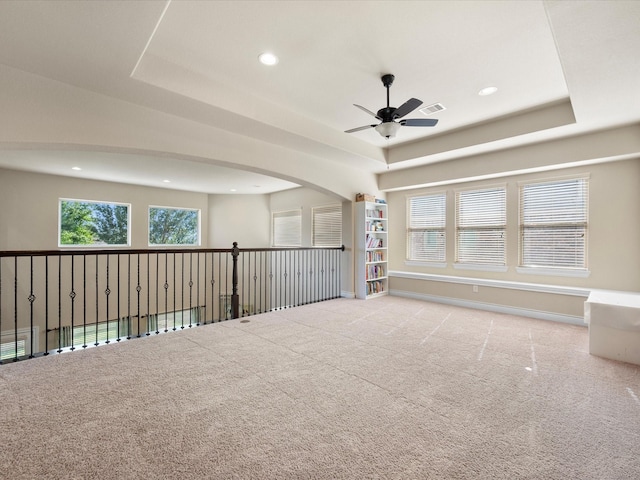8322 Sands Bank Ln, Conroe, TX 77304 - carpeted empty room featuring ceiling fan, a raised ceiling, and recessed lighting