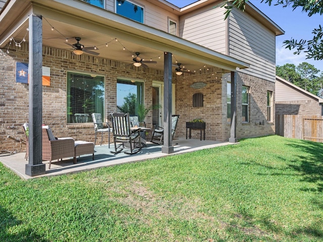 8322 Sands Bank Ln, Conroe, TX 77304 - rear view of house with ceiling fan, brick siding, and a patio