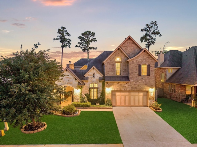 8322 Sands Bank Ln, Conroe, TX 77304 - french country home featuring stone siding, driveway, a front lawn, and an attached garage