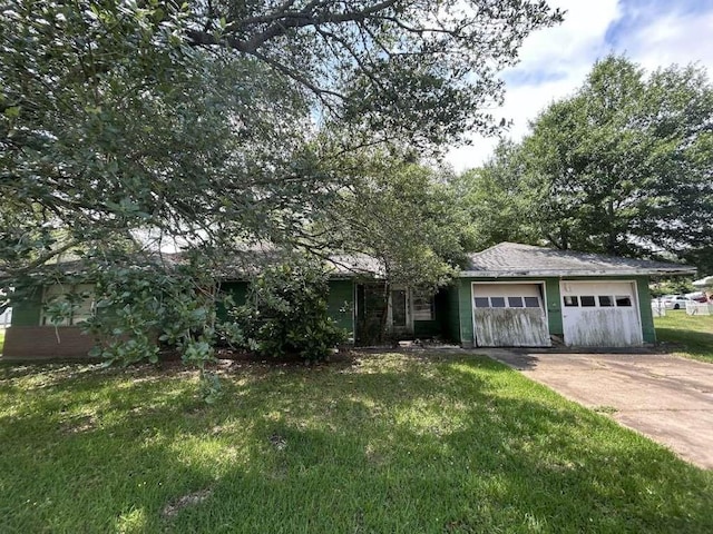 3429 Graves Ave, Groves, TX 77619 - view of front of house with driveway, an attached garage, and a front lawn