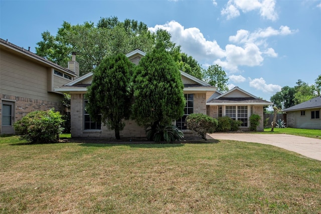 4035 Green Crst, Houston, TX 77082 - view of front of house featuring a front lawn, brick siding, and concrete driveway
