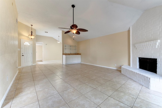 4035 Green Crst, Houston, TX 77082 - unfurnished living room with vaulted ceiling, a ceiling fan, light tile patterned flooring, a brick fireplace, and baseboards