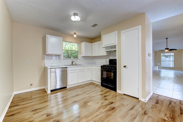 4035 Green Crst, Houston, TX 77082 - kitchen with dishwasher, black gas stove, a sink, light wood-style flooring, and white cabinets