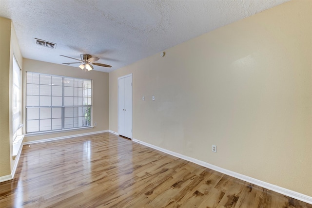4035 Green Crst, Houston, TX 77082 - unfurnished room featuring ceiling fan, light wood-type flooring, a textured ceiling, and baseboards
