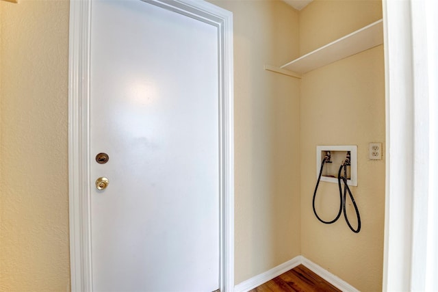 4035 Green Crst, Houston, TX 77082 - laundry area with dark wood-style flooring, washer hookup, and baseboards