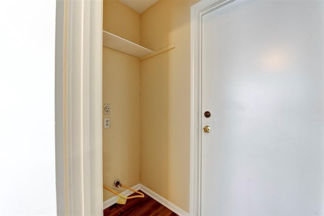 4035 Green Crst, Houston, TX 77082 - laundry area featuring dark wood-style flooring and baseboards