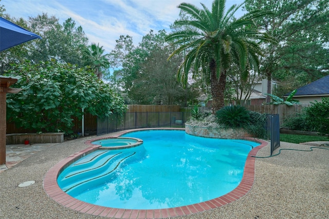 26 E Sterling Pond Cir, The Woodlands, TX 77382 - view of pool featuring a fenced backyard, a pool with connected hot tub, and a patio area