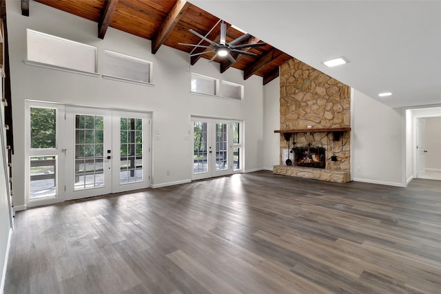 118 Glenview, Livingston, TX 77351 - unfurnished living room with french doors, wooden ceiling with exposed beams, ceiling fan, wood finished floors, and high vaulted ceiling