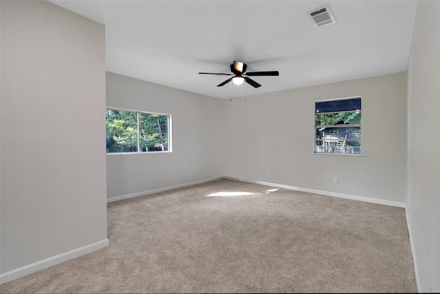 118 Glenview, Livingston, TX 77351 - carpeted spare room featuring healthy amount of natural light, baseboards, and a ceiling fan