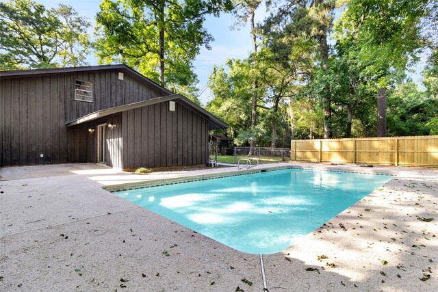 118 Glenview, Livingston, TX 77351 - view of pool featuring a patio and view of scattered trees