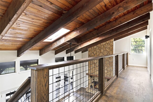 118 Glenview, Livingston, TX 77351 - corridor featuring wood ceiling with exposed beams, wood finished floors, baseboards, and a skylight
