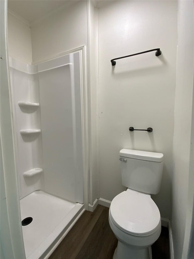 118 Glenview, Livingston, TX 77351 - full bath with a shower stall, wood finished floors, baseboards, and toilet