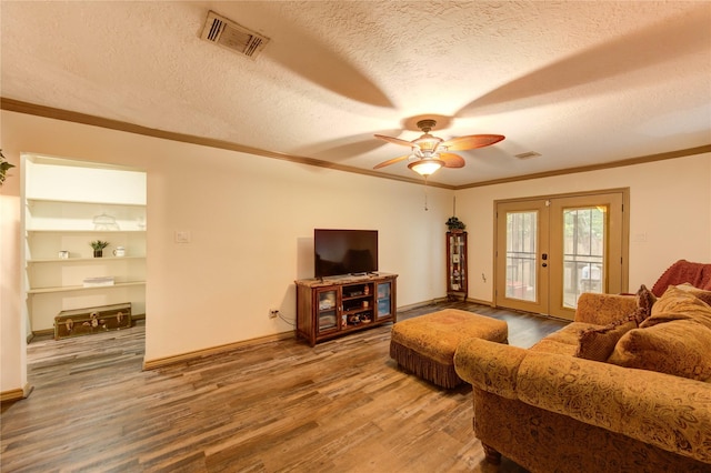 4603 New Orleans St, Houston, TX 77020 - living room featuring french doors, ornamental molding, wood finished floors, a ceiling fan, and a textured ceiling