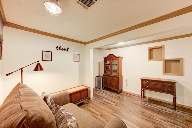 4603 New Orleans St, Houston, TX 77020 - living area with ornamental molding, wood finished floors, and baseboards