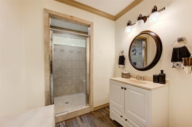 4603 New Orleans St, Houston, TX 77020 - bathroom with a stall shower, wood finished floors, vanity, crown molding, and baseboards