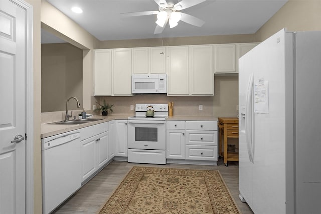 2815 Kings Crossing Dr Unit 102, Houston, TX 77345 - kitchen featuring white appliances, a sink, a ceiling fan, light countertops, and recessed lighting