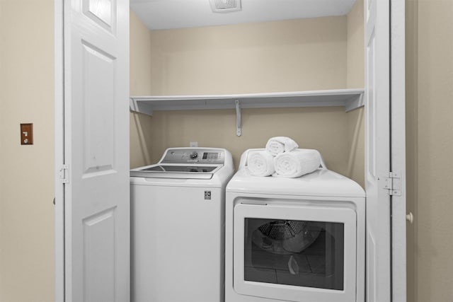 2815 Kings Crossing Dr Unit 102, Houston, TX 77345 - washroom with washing machine and dryer