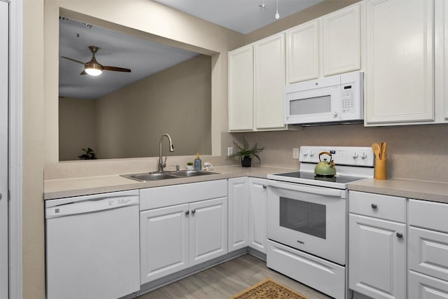 2815 Kings Crossing Dr Unit 102, Houston, TX 77345 - kitchen with white appliances, a sink, light wood-style flooring, ceiling fan, and white cabinetry