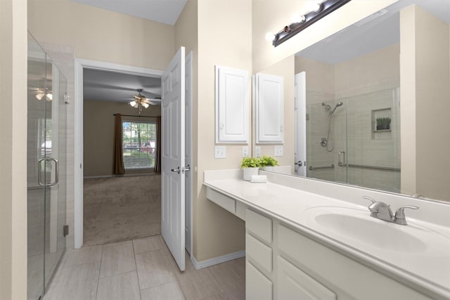 2815 Kings Crossing Dr Unit 102, Houston, TX 77345 - full bath with vanity, a stall shower, a ceiling fan, baseboards, and tile patterned floors